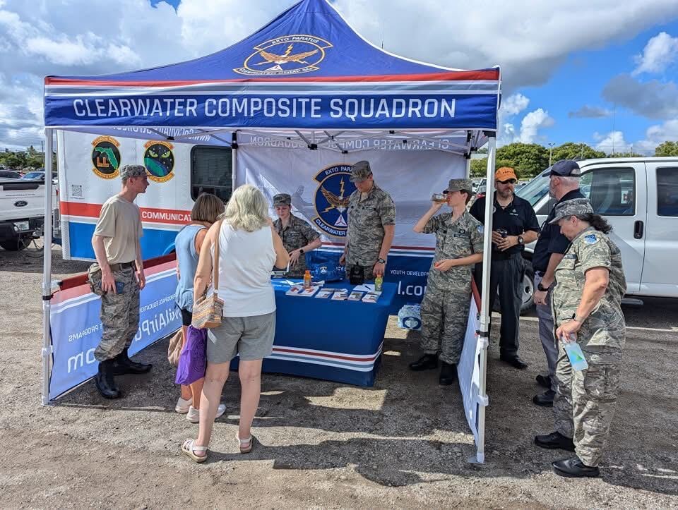 Squadron members staffing the Clearwater Composite Squadron booth at a community event