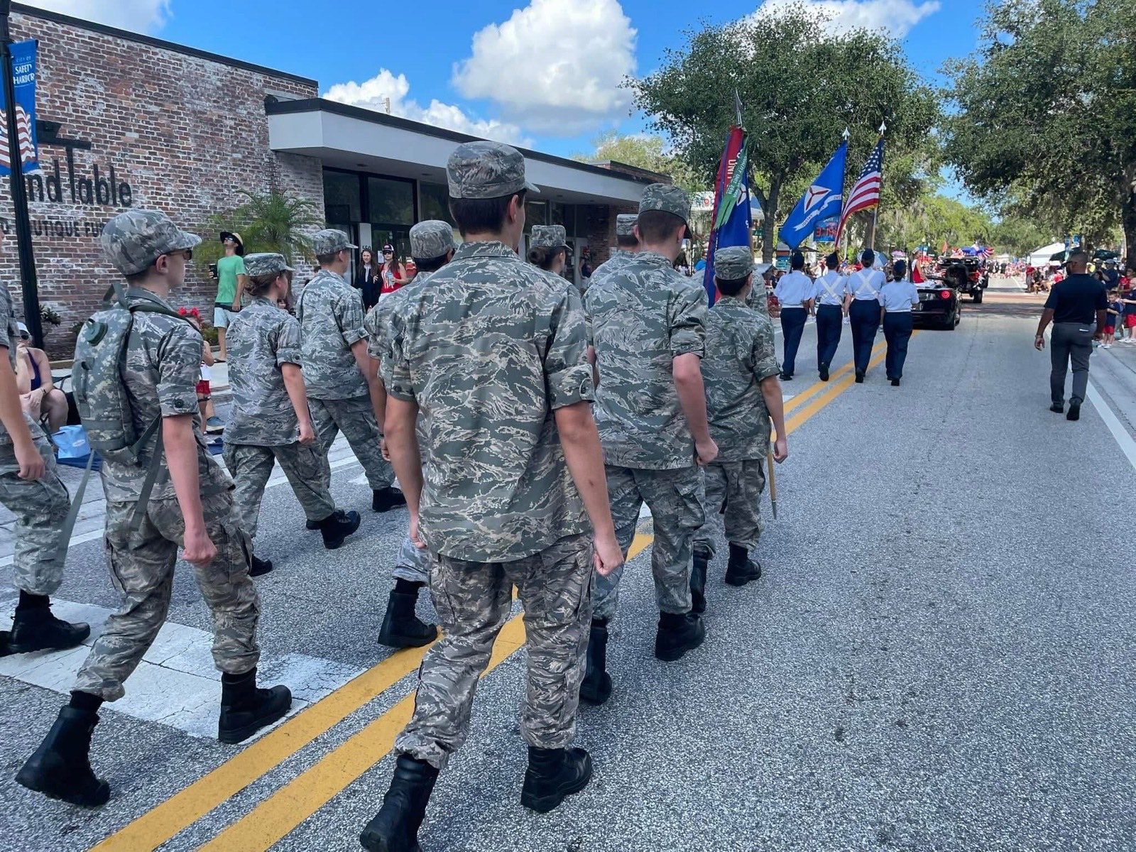 Clearwater Composite Squadron cadets marching behind the color guard in a Florida community parade